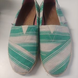 Tom's green and white strip shoes